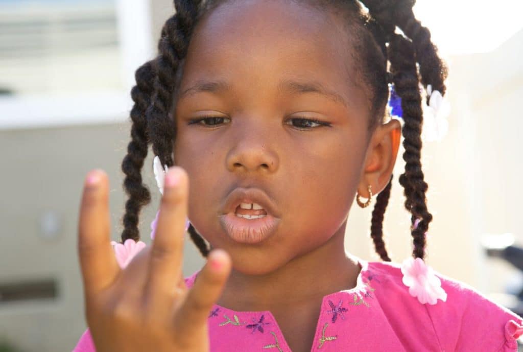 Child counting on fingers